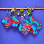 NECESSAIRE_LONA_TRIANGULO_P_TURISTA_2026_CEU_DE_CACAU_VA22659_PAPEL_CRAFT_2